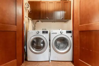 a laundry room with a washer and dryer at Solara Suite with Indoor Pool - Hot tub -Parking - GYM in Canmore