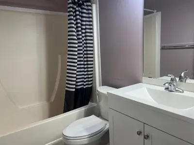 a white bathroom with a sink and a toilet at Private Rooms in a 3 Bedroom Guest House Close to Londonderry Mall 1 Person per Room No Couples For Men Only in Edmonton