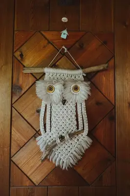 an ornament of an owl head on a wooden floor at Mini-Mooh cabin in Clearwater