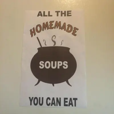 a sign that says all the homemade soups you can eat at Old Towne Inne Chuckwagon Bar & Grill in Boston Bar