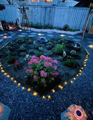 a garden with flowers and lights in the shape of a heart at Banff Garden Suite&2mins Bus station Close LRT& Free Parking in Calgary