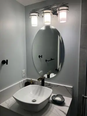 a bathroom with a white sink and a mirror at Banff Garden Suite&2mins Bus station Close LRT& Free Parking in Calgary