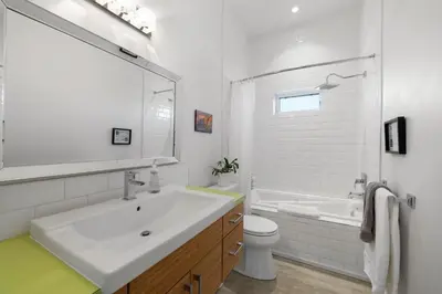 a white bathroom with a sink and a toilet at Carbon Valley Ranch in Grainger