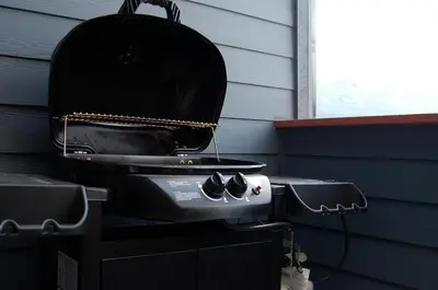 a grill sitting on top of a house at Apartment 405 Bear Creek Crossing in Canmore