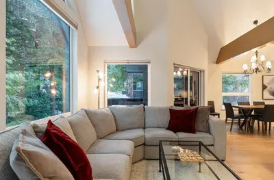 a living room with a couch and a table at 3BR in Snowgoose, Ski In, Luxury Property, Free Shuttle to Lifts, Parking in Whistler