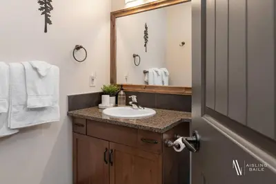 a bathroom with a sink and a mirror at Heavenly Mountain Hideaway, Pool, Hot Tub in Radium Hot Springs