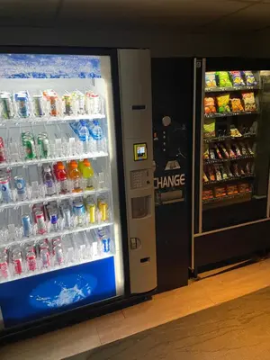 a drink cooler in a store with drinks in it at Aspens on the Mountain Ski In Out in Whistler