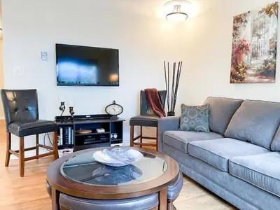 a living room with a couch and a table at Radium Villas in Radium Hot Springs