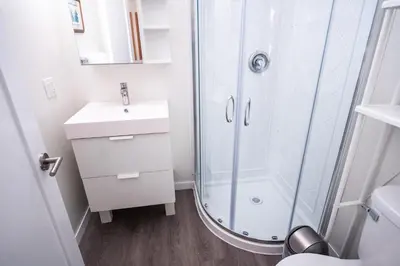 a bathroom with a shower and a sink at Kingfisher, Newly Renovated Suite on Ocean Inlet in Ucluelet