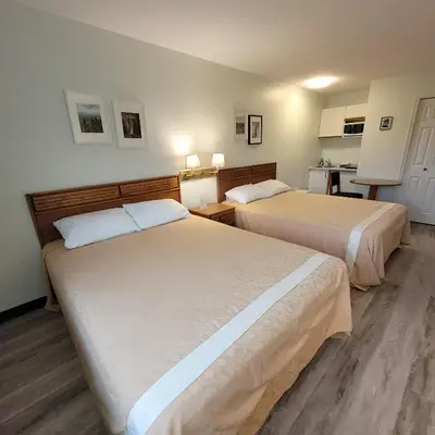 a hotel room with two beds and a kitchen at Ridgeview Motor Inn in Gold River