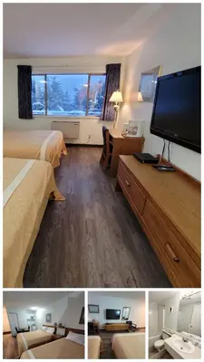 a hotel room with two beds and a flat screen tv at Ridgeview Motor Inn in Gold River