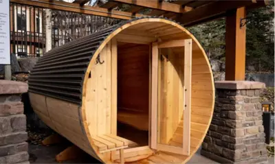 a wooden boat sitting on top of a building at Spacious Penthouse Suite-King Beds-Pool & Hot Tub in Canmore