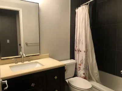 a bathroom with a sink and a toilet and a shower at citadel hills valley in Calgary