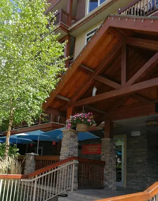 a porch of a house with a wooden roof at Sunny Tranquil Woods Turret in Falcon Crest Lodge in Canmore