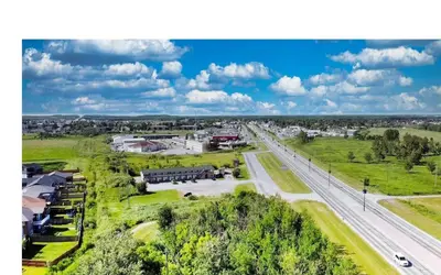 an overhead view of a town with a road and buildings at Kings Court Motel in Cold Lake