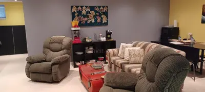 a living room with two chairs and a couch at Mountain Calm & Private Ensuite Hosted by Maureen in Calgary