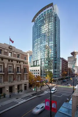 a view of a city with a tall glass building at Auberge Vancouver Hotel in Vancouver
