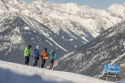 a group of people standing on top of a snow covered mountain at Lookout Pointe, Lakeview, Pool, Hot Tub, Gym in Invermere