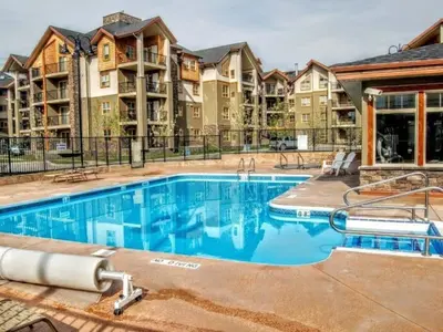 an image of a swimming pool at a apartment complex at Lookout Pointe, Lakeview, Pool, Hot Tub, Gym in Invermere