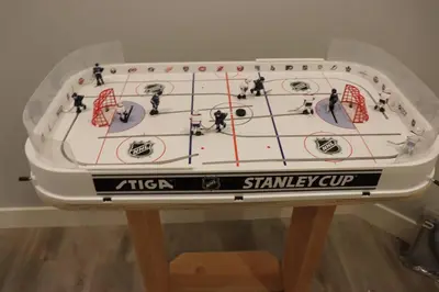 a table with a game of hockey on it at Ski in Ski Out with Huge Game Room and Hot Tub in Fernie