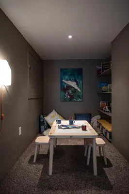 a room with a table and two chairs in a room at Mackenzie House by Revelstoke Vacations in Revelstoke