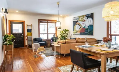 a living room with a couch and a table at Mackenzie House by Revelstoke Vacations in Revelstoke