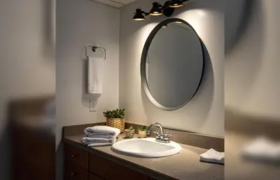 a bathroom with a sink and a mirror at Mackenzie House by Revelstoke Vacations in Revelstoke