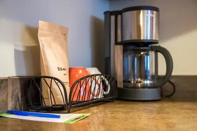 a kitchen counter with a coffee maker and a blender at Give Something Back Retreat by Revelstoke Vacations in Revelstoke