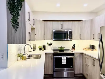 a kitchen with a sink and a stove at Granite Ridge Condo by Revelstoke Vacations in Revelstoke