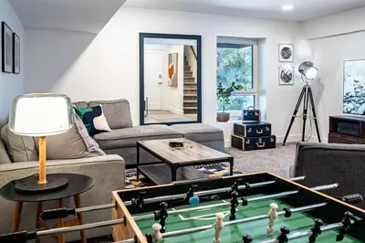 a living room with a pool table at Revelation Retreat by Revelstoke Vacations in Revelstoke