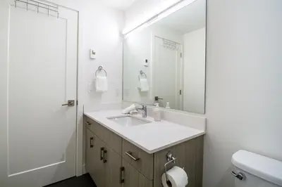 a bathroom with a sink and a mirror at Magog Condo by Revelstoke Vacations in Revelstoke