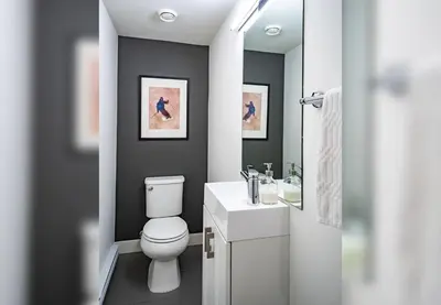 a bathroom with a white toilet and a sink at Alpine Escape by Revelstoke Vacations in Revelstoke