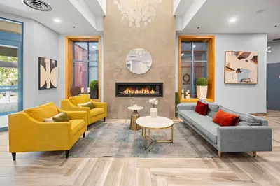 a living room with two couches and a fireplace at Alpenglow Lodge Studio with Pool Views by MVA in Whistler