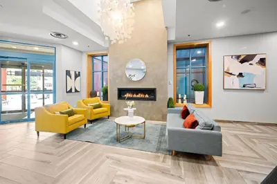 a living room with two couches and a fireplace at Alpenglow Lodge Rainbow Look Out Studio by MVA in Whistler