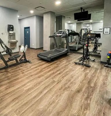 a gym with treadmills ellipticals and tread machines at Alpenglow Lodge Junior One Bedroom by MVA in Whistler
