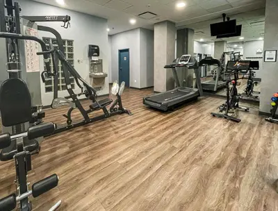 a gym with several treadmills and cardio machines at Alpenglow Lodge Large Studio with Dedicated Work Space by MVA in Whistler