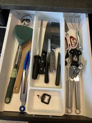 a white container filled with various kitchen utensils at Beautiful Downtown Loft with full kitchen in Vancouver