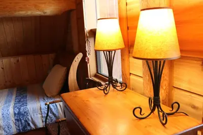 two lamps on a wooden table in a room at Bear Valley Highlands in Lumby