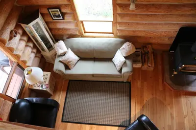 an overhead view of a couch in a tiny house at Bear Valley Highlands in Lumby