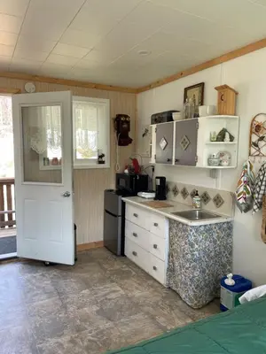 a kitchen with a sink and a counter top at Jade City Dog House in Jade City