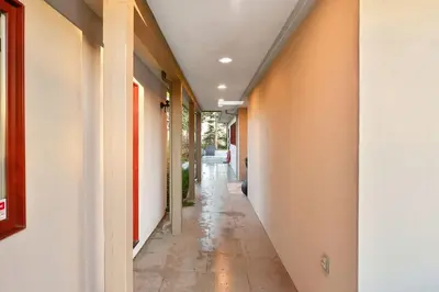 an empty hallway of a building with a hallway at Beachside Living Cherry Point by EMR Vacation Rentals in Cobble Hill
