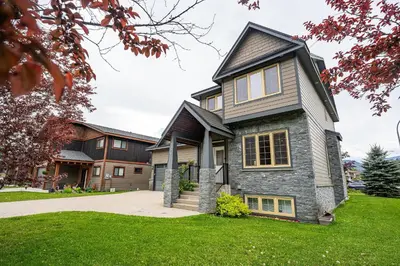 a home with a stone house at Aspen Lodge by Revelstoke Vacations in Revelstoke