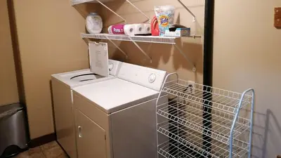 a washer and dryer in a laundry room at Woodhaven #19 by Bear Country in Sun Peaks