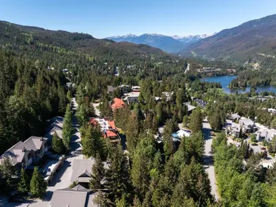 an aerial view of a town with trees and a lake at 3BR in Whistler Creek Ridge, Ski In, Ski Out, Private Hot Tub, Wood Burning Fireplace, Private Garage in Whistler