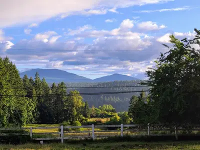 a view of the mountains from a farm house at The Cottage on the Farm in Ladysmith