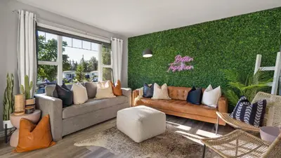 a living room with couches and a green wall at The Saturday I Perfect for Families I Arcade Games in Sylvan Lake