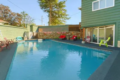 a swimming pool in the backyard of a house at Hidden Oasis in Victoria, BC in Victoria