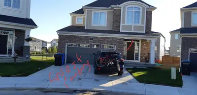 a bike parked in front of a garage at Guest Suite in Calgary in Calgary