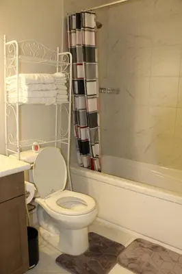 a bathroom with a toilet and a shower at Guest Suite in Calgary in Calgary