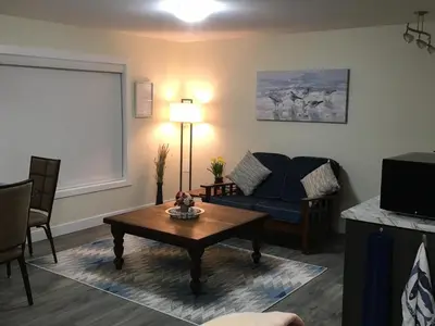 a living room with a couch and a coffee table at Lakeview Gardens B&B in Peachland